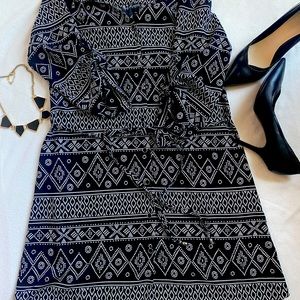 Knee length black and white patterned dress